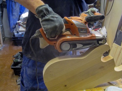 The body edges needed some levelling after the router, so I grabbed my good ole belt sander...