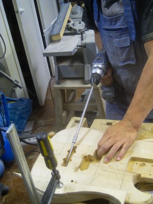 The pickup wire channels between the pickup cavities and the electronics cavity had to be drilled.