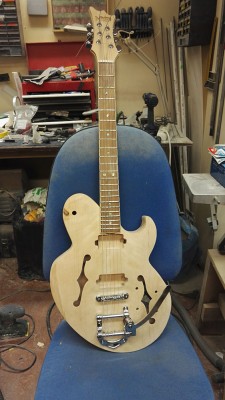 Here's the guitar project, strung and with the Bigsby type trem. The chambered body resonates nicely. Once I have leveled the frets, I'll start painting the instrument. I have hunch she'll become a really nice guitar.