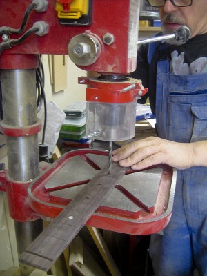 Drilling fret marker pits with a 6 mm brad point drill bit.