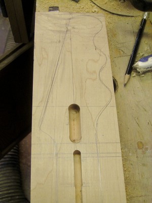 The Alligatrix has a pit for the Allen key.  It facilitates accessing the bullet type nut of the truss rod. I rout the pit with a round tip bit after routing the truss rod channel.