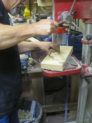 Drilling tuner holes in the headstock with a 10 mm brad point drill bit.