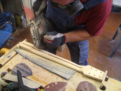 Crude shaping the neck with a belt sander. I've never been good with spokeshaves.