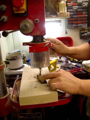 Drilling slug holes in the flatwork.