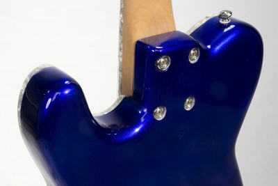 The neck joint is done with with ferrules in stead of an attachment plate. The back edge is so round that the ferrules were the right way to do it. The body back is very comfortable and I like the look of it too.