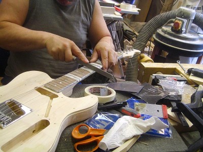 Levelling the frets was a time-consuming task, but the fretboard did turn out good, eventually.