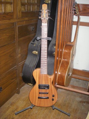 This guitar has a ribbon striped mahogany top