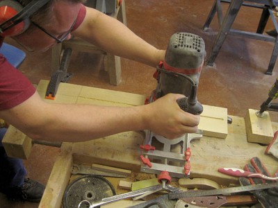 Routing the truss rod channel in the back of the one-piece birch neck.