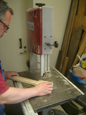 Cutting out the neck from the blank with a bandsaw.
