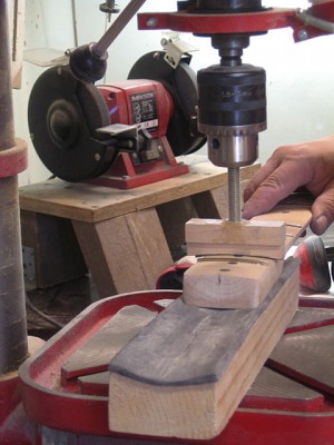 I used my drill press with a self-made 16&quot; radius fret pressing caul to press in the frets.