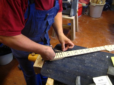 I cut 1&quot; wide masking tape to 3 mm wide strips with a scalpel and a steel ruler, then masked the frets over before lacquering the neck.