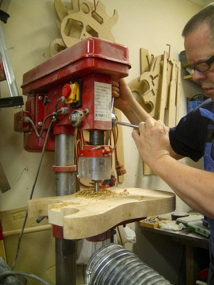 Drilling the electronics cavity and the pickup cavities prior to routing.