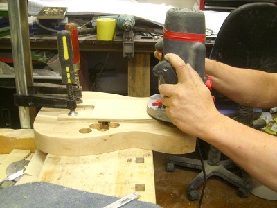 Then off to routing the neck pocket to the right depth and shape.