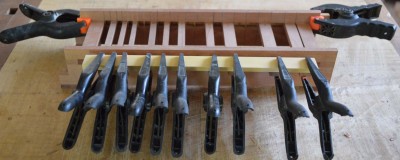 The semitone keys receiving the top part of the touchplates. The reason for doing thm all at once is simply to make the whole thing perfectly aligned the easy way, not to cut down on the work. (Though that happens as well, an added bonus.)<br />The two clamps at the back are holding a strip of wood making sure the keys are aligned there, as well as at the front.